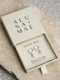 Silver freshwater pearl hoop earrings presented in an Aluna Mae gift box with a “thank you for being my bridesmaid” message.