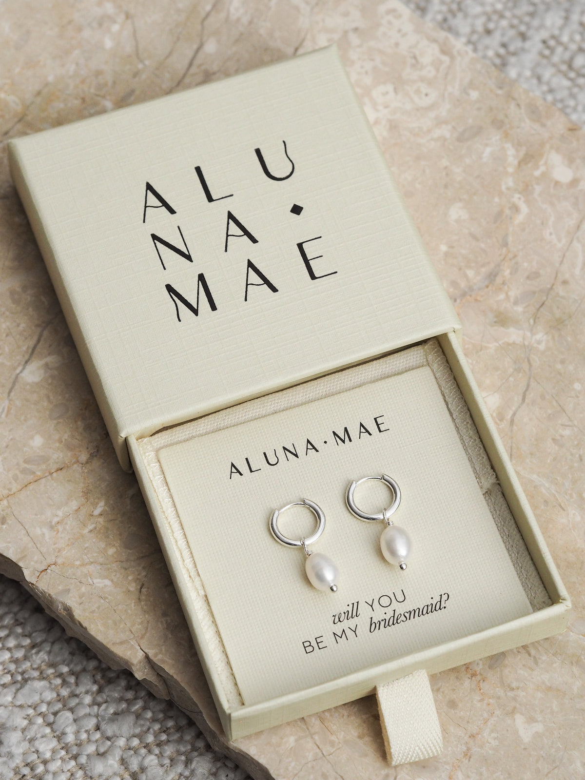 Silver freshwater pearl hoop earrings in an Aluna Mae gift box with the message “will you be my bridesmaid?”