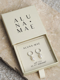 Silver freshwater pearl hoop earrings in an Aluna Mae gift box with the message “will you be my bridesmaid?”