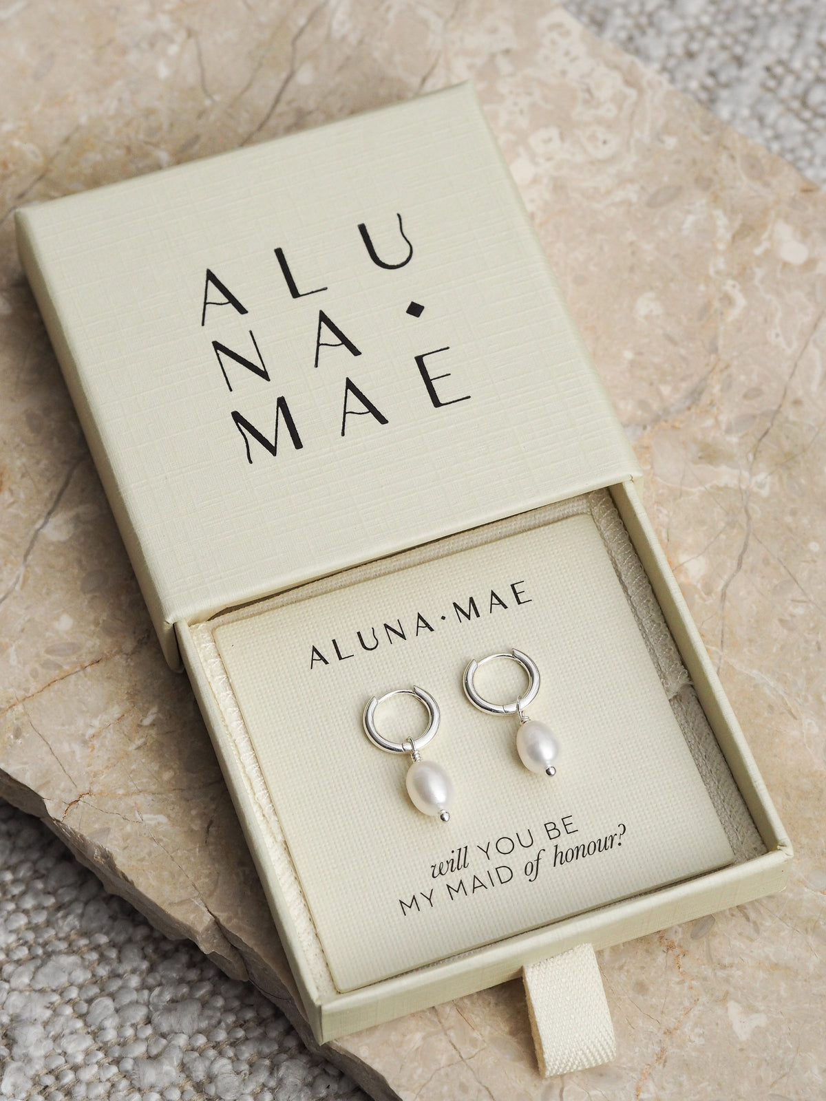 Silver freshwater pearl hoop earrings in an Aluna Mae gift box with the message “will you be my maid of honour?”