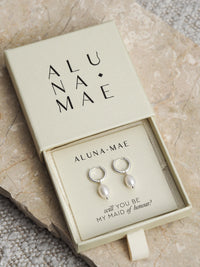 Silver freshwater pearl hoop earrings in an Aluna Mae gift box with the message “will you be my maid of honour?”