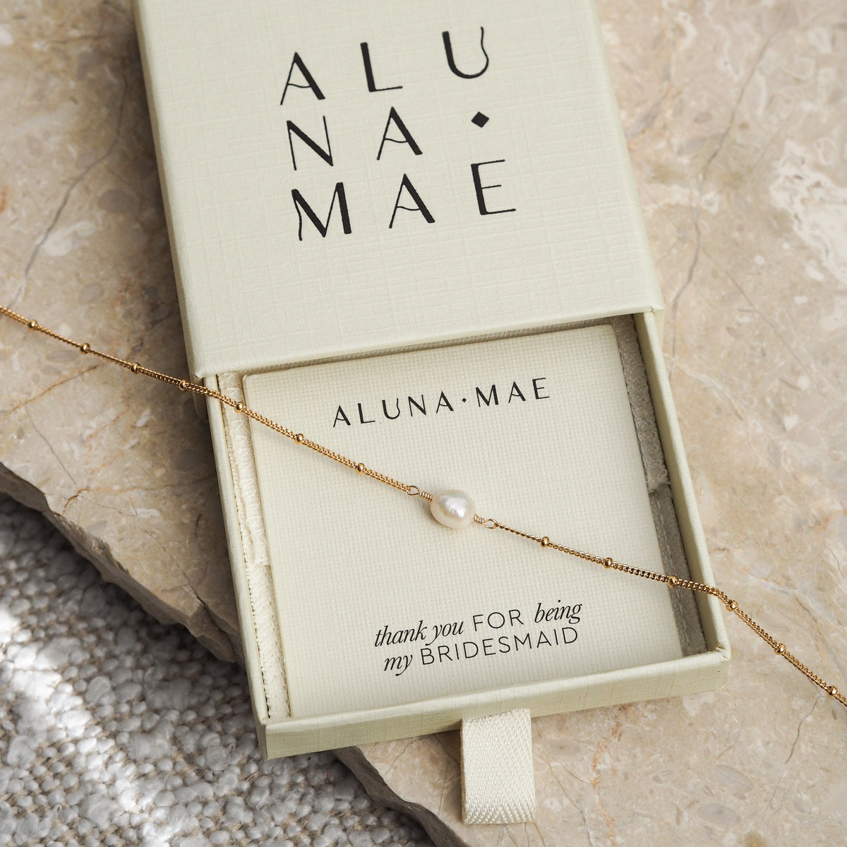 Freshwater pearl gold satellite chain bridesmaid necklace in Aluna Mae gift box with 'Thank you for being my bridesmaid' card.
